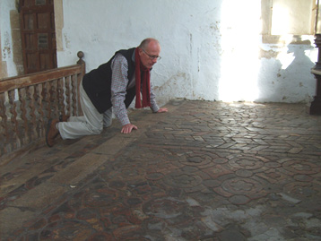 Clive inspecting a tiled church floor.